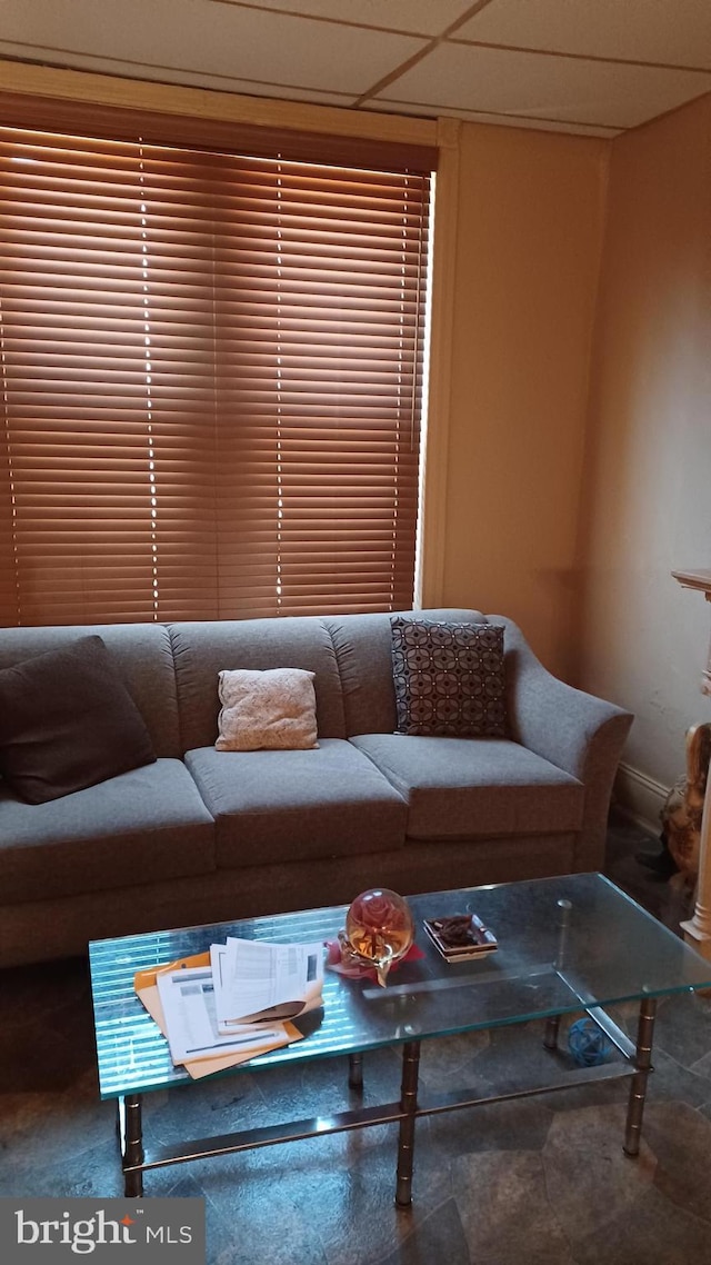 living area featuring baseboards