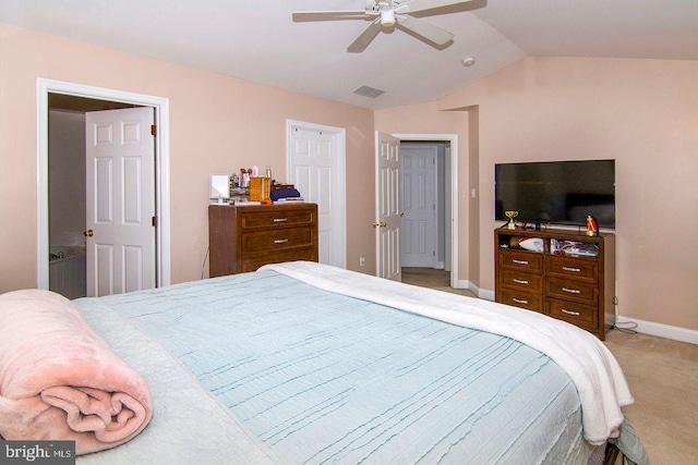 bedroom with a ceiling fan, visible vents, light colored carpet, vaulted ceiling, and baseboards