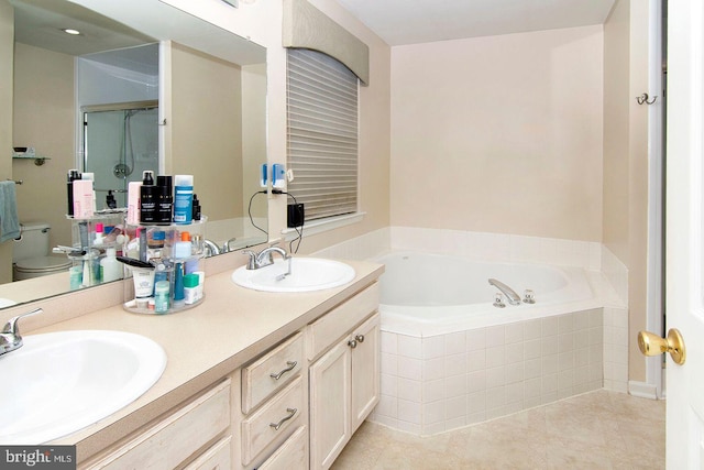 full bath featuring a sink, tile patterned flooring, a stall shower, and a bath