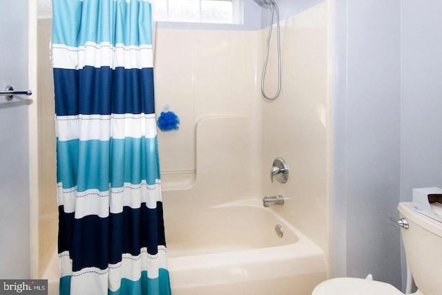 full bathroom with toilet and shower / tub combo with curtain