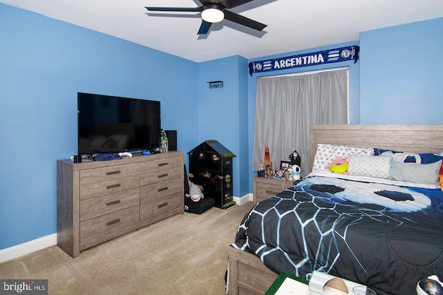 bedroom with carpet flooring, baseboards, and ceiling fan