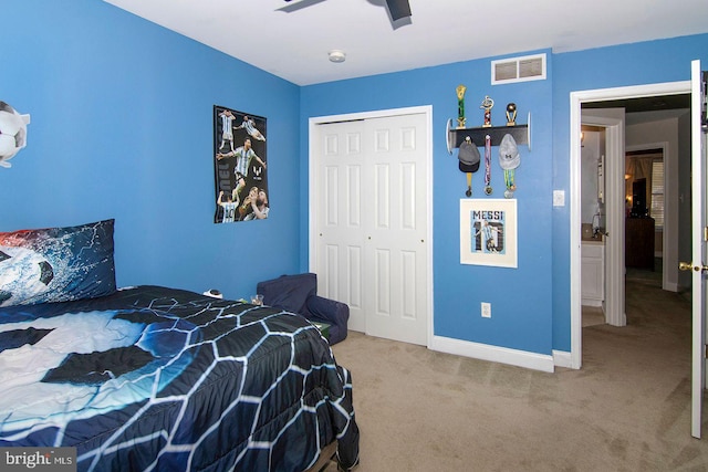 bedroom featuring ceiling fan, visible vents, baseboards, a closet, and carpet