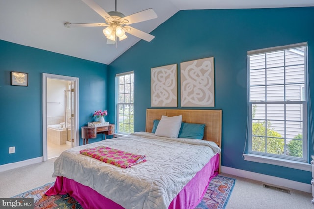bedroom with carpet, vaulted ceiling, visible vents, baseboards, and ensuite bathroom