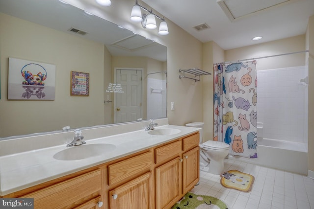 bathroom featuring double vanity, visible vents, and a sink