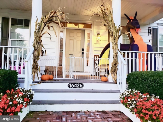 entrance to property with covered porch