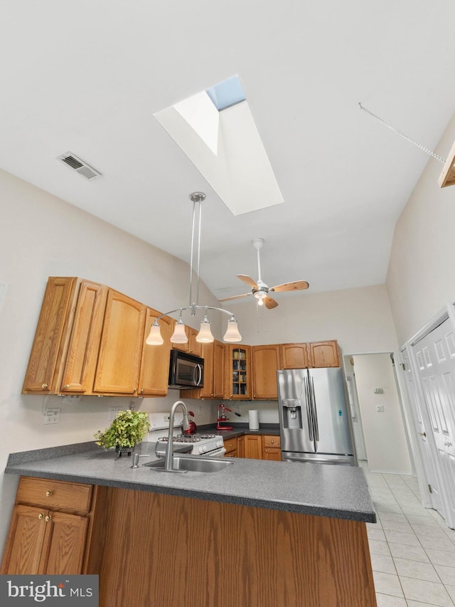 2 Windmill Ct, Columbus, NJ 08022 - kitchen with visible vents, a peninsula, black microwave, stainless steel fridge with ice dispenser, and a skylight