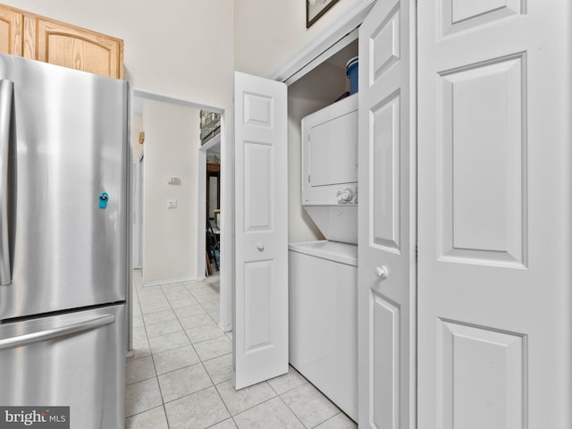 2 Windmill Ct, Columbus, NJ 08022 - kitchen featuring freestanding refrigerator, stacked washer and clothes dryer, light tile patterned floors, and light brown cabinetry