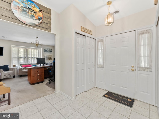 2 Windmill Ct, Columbus, NJ 08022 - foyer entrance featuring light tile patterned flooring, light colored carpet, an inviting chandelier, baseboards, and visible vents