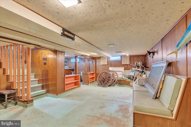 below grade area with stairway and wood walls