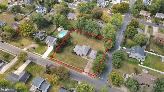 birds eye view of property with a residential view