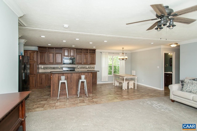 kitchen featuring recessed lighting, light colored carpet, black appliances, a breakfast bar, and ornamental molding