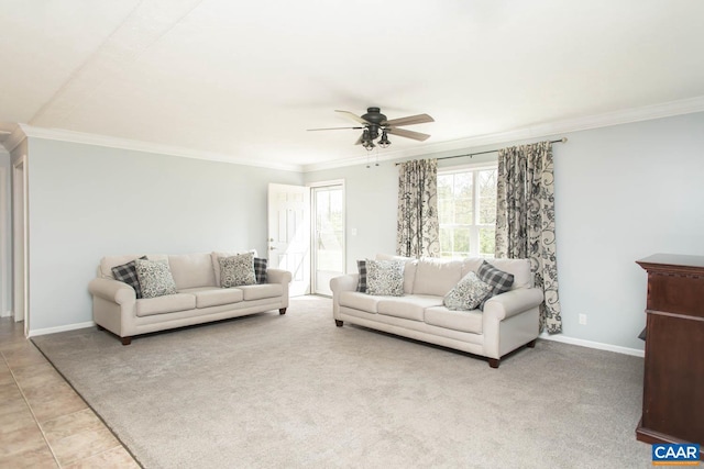 living room featuring ceiling fan, baseboards, and ornamental molding