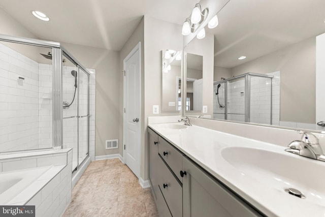 bathroom featuring a shower stall, baseboards, and a sink
