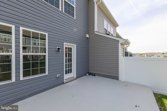 view of patio featuring fence