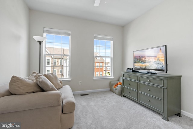 19961 Major Sq, Ashburn, VA 20147 - living area featuring baseboards, light colored carpet, and a ceiling fan