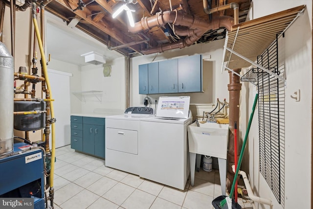 5 Morgan Rd, Aston, PA 19014 - laundry room featuring cabinet space, separate washer and dryer, light tile patterned flooring, and a heating unit