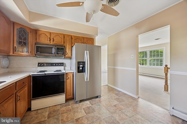 5 Morgan Rd, Aston, PA 19014 - kitchen with appliances with stainless steel finishes, a baseboard heating unit, and brown cabinets