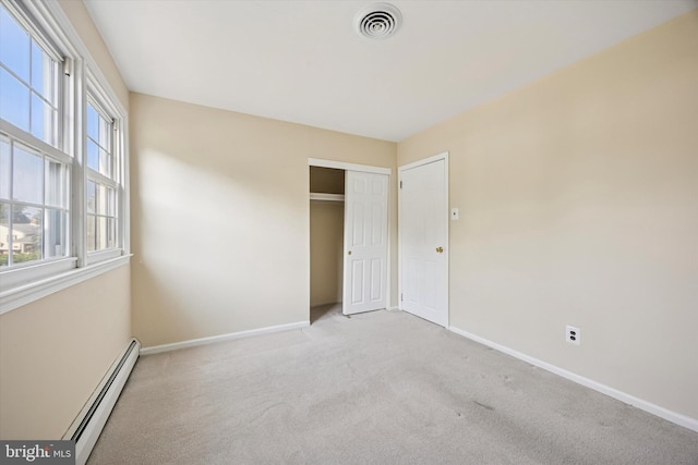 5 Morgan Rd, Aston, PA 19014 - unfurnished bedroom with a baseboard heating unit, carpet floors, and a closet