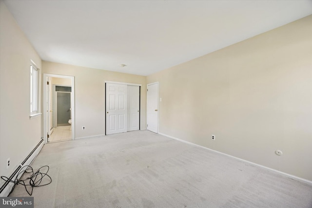 5 Morgan Rd, Aston, PA 19014 - unfurnished bedroom with a baseboard heating unit, light colored carpet, ensuite bathroom, and a closet