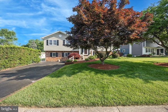 5 Morgan Rd, Aston, PA 19014 - view of front of property with brick siding, driveway, and a front yard