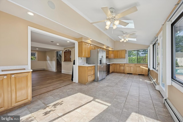 5 Morgan Rd, Aston, PA 19014 - kitchen with appliances with stainless steel finishes, ceiling fan, light countertops, baseboard heating, and vaulted ceiling