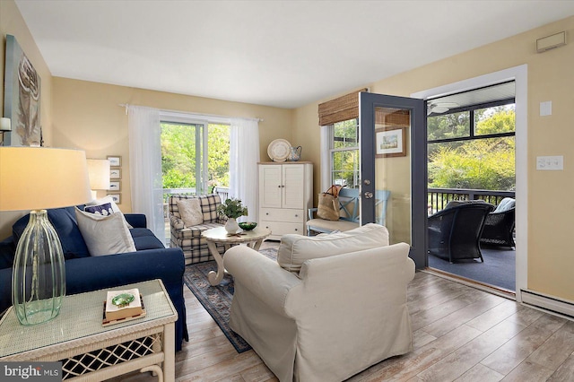 living area featuring french doors and hardwood / wood-style floors
