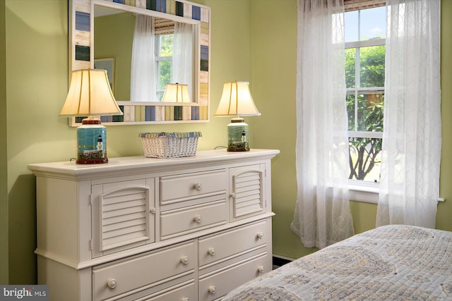 bedroom featuring multiple windows