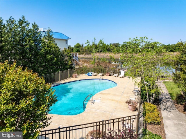 pool with fence and a patio