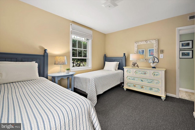 bedroom with visible vents, carpet, and baseboards