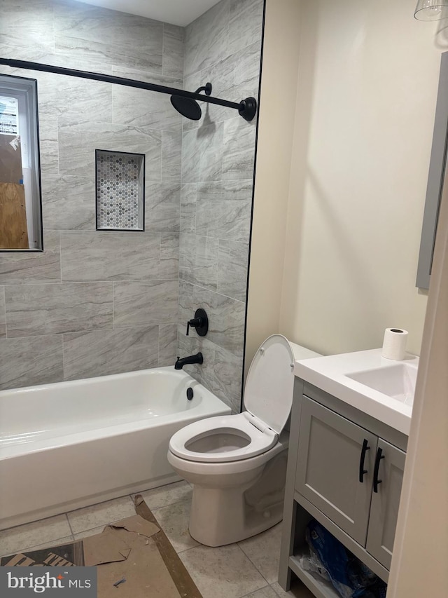 full bathroom featuring toilet, washtub / shower combination, and vanity