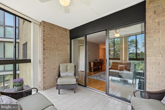 15100 Interlachen Dr Unit 4-522, Silver Spring, MD 20906 - sunroom / solarium featuring tile patterned floors, a ceiling fan, and brick wall