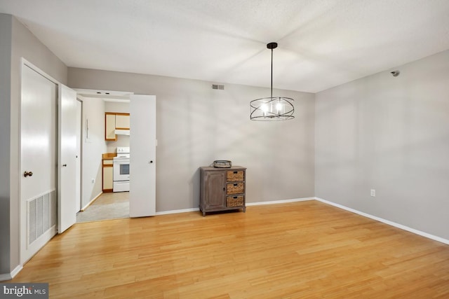 15100 Interlachen Dr Unit 4-522, Silver Spring, MD 20906 - unfurnished room with light wood-type flooring and baseboards