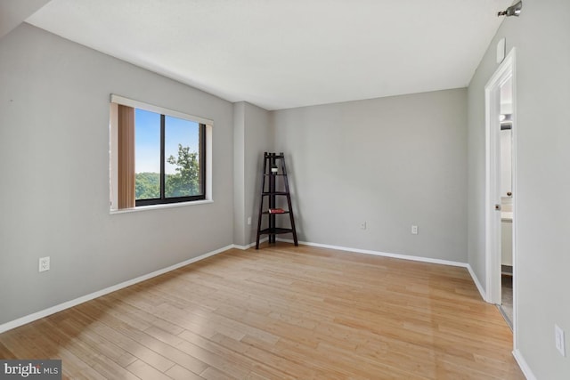 15100 Interlachen Dr Unit 4-522, Silver Spring, MD 20906 - spare room featuring light wood finished floors and baseboards
