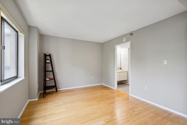 15100 Interlachen Dr Unit 4-522, Silver Spring, MD 20906 - empty room with light wood-style flooring and baseboards