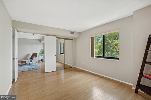 15100 Interlachen Dr Unit 4-522, Silver Spring, MD 20906 - unfurnished bedroom with light wood-type flooring and a closet