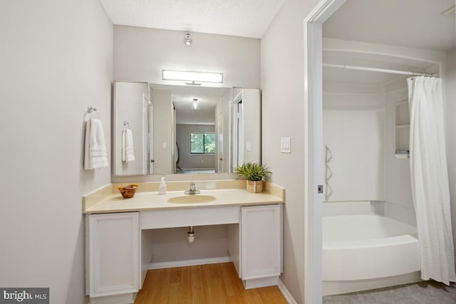15100 Interlachen Dr Unit 4-522, Silver Spring, MD 20906 - bathroom with vanity, wood finished floors, and shower / bathtub combination with curtain