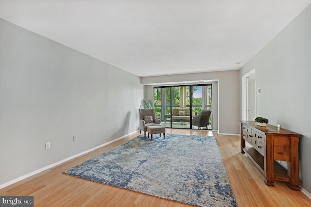 15100 Interlachen Dr Unit 4-522, Silver Spring, MD 20906 - living area featuring wood finished floors and baseboards
