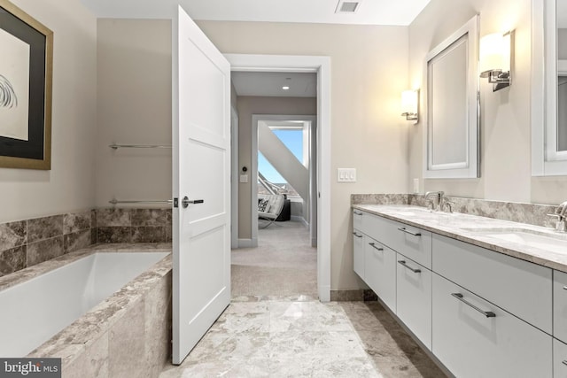 50 S 16th St Unit 5602, Philadelphia, PA 19102 - full bathroom featuring a garden tub, a sink, double vanity, baseboards, and visible vents