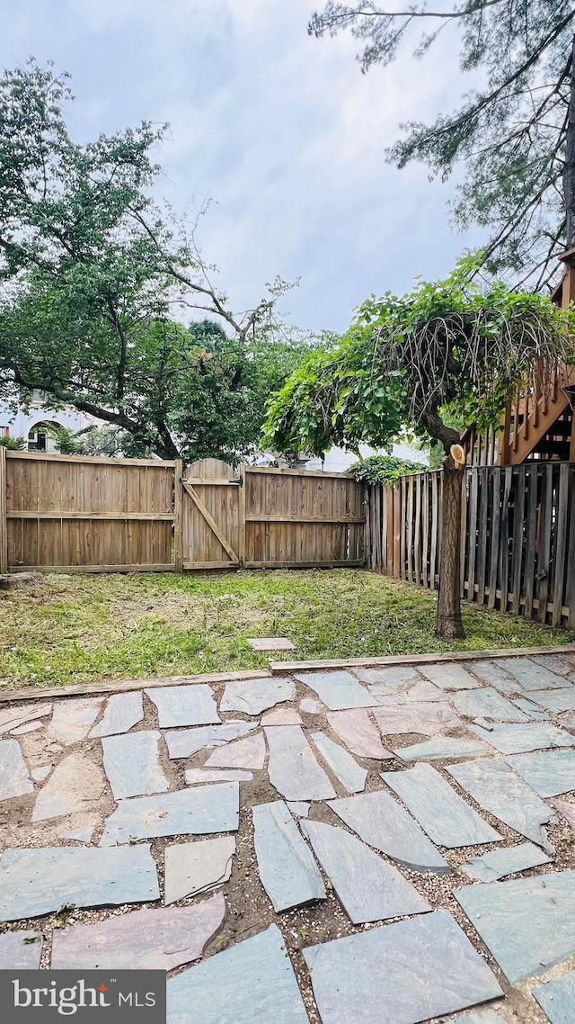 view of patio / terrace featuring a gate