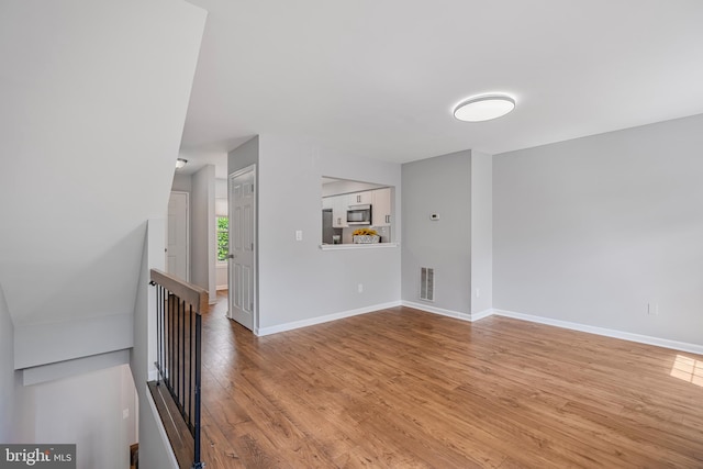 10310 Bridgetown Pl Unit 56, Burke, VA 22015 - spare room with wood finished floors and baseboards