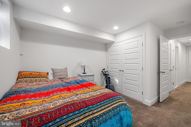 bedroom with recessed lighting, baseboards, a closet, and carpet
