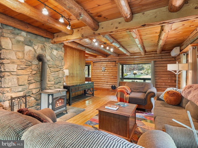 living room featuring a wood stove, wood ceiling, beam ceiling, and hardwood / wood-style floors