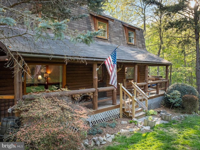 view of front of home featuring a shingled roof