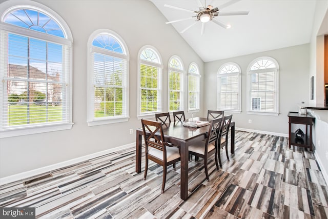 dining room featuring baseboards, visible vents, wood finished floors, and ceiling fan