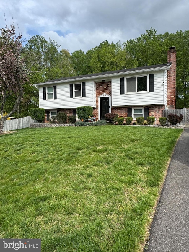 2116 Bell Tree Ln, Waldorf, MD 20601 - raised ranch with a chimney and brick siding