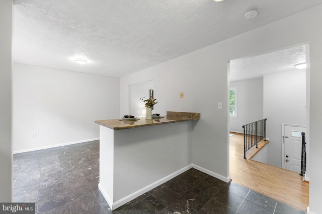 2116 Bell Tree Ln, Waldorf, MD 20601 - bar with a textured ceiling and baseboards