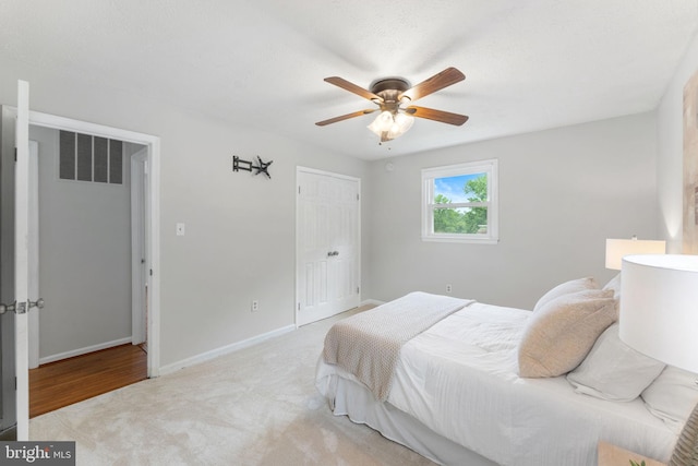 2116 Bell Tree Ln, Waldorf, MD 20601 - bedroom with light colored carpet, baseboards, a closet, and a ceiling fan