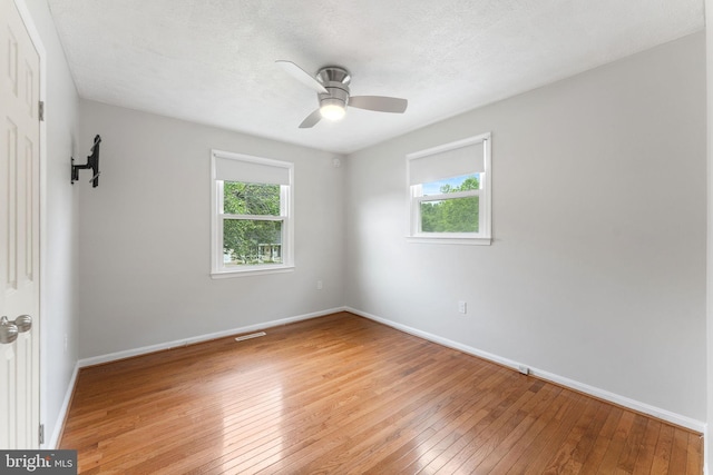 2116 Bell Tree Ln, Waldorf, MD 20601 - unfurnished room featuring light wood finished floors, healthy amount of natural light, baseboards, and ceiling fan