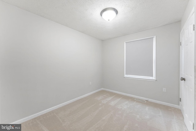 2116 Bell Tree Ln, Waldorf, MD 20601 - empty room with light colored carpet, a textured ceiling, and baseboards