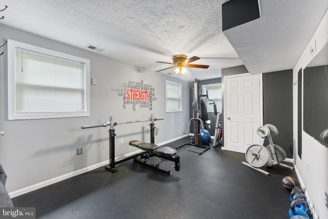 2116 Bell Tree Ln, Waldorf, MD 20601 - exercise area with a ceiling fan, baseboards, and a textured ceiling